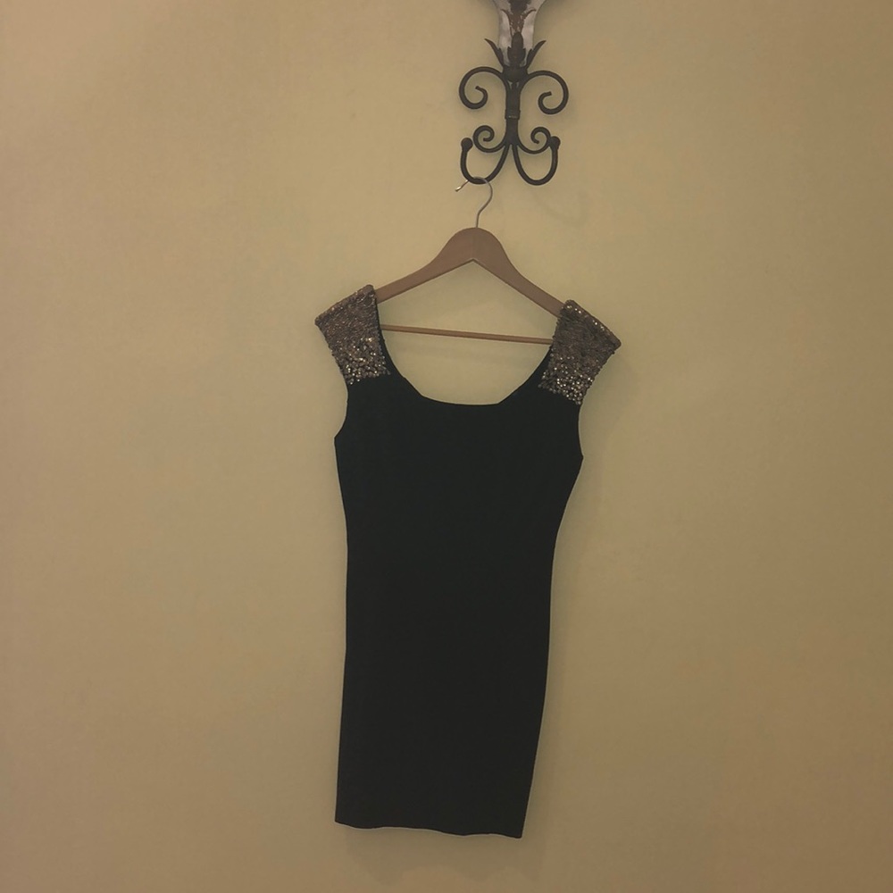 Black evening dress with gold cap sleeves